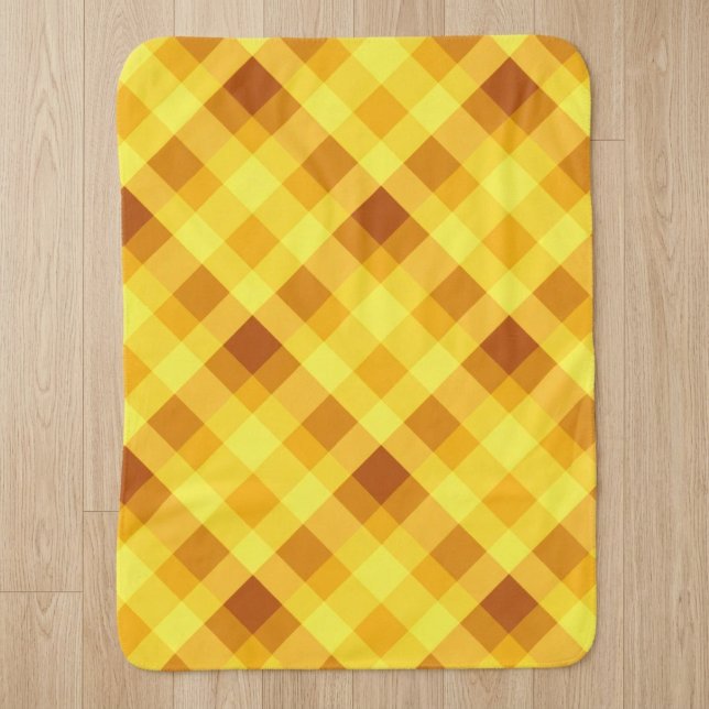 Petite couverture Sherpa à carreaux jaune d'œuf mi (Cute Egg Yolk Yellow Plaid Small Sherpa Blanket on a wooden floor in a home.)