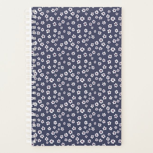 Petites fleurs blanches sur un planificateur bleu (Devant)