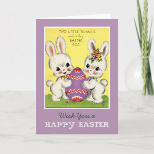 Petits lapins et carte de voeux d'oeufs de Pâques