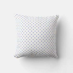 Petits pois bleu cobalt sur un coussin de jet blan