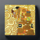 Photo Gustav Klimt Fulfillment Plaque<br><div class="desc">Gustav Klimt Fulfillment plaque. Frieze from 1909. Completed during Klimt’s golden phase, Fulfillment features an embracing couple holding each other beneath a multi-patterned quilt featuring spirals, eyes, birds, fish and other shapes. The background of the work features the same bronze spirals that would adorn the artist’s renowned Tree of Life....</div>