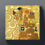 Photo Gustav Klimt Fulfillment Plaque<br><div class="desc">Gustav Klimt Fulfillment plaque. Frieze from 1909. Completed during Klimt’s golden phase, Fulfillment features an embracing couple holding each other beneath a multi-patterned quilt featuring spirals, eyes, birds, fish and other shapes. The background of the work features the same bronze spirals that would adorn the artist’s renowned Tree of Life....</div>