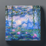 Photo Monet Water Lilies Plaque<br><div class="desc">Monet Water Lilies plaque. Oil painting on canvas from 1916. Monet painted his famous water lily pond obsessively during the final years of his career, drawing inspiration from the light of the sun and its shifting effect on the water and the aquatic flowers and foliage. This painting features a vibrant...</div>