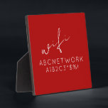 Photo Stylish Red WiFi Password Sign Plaque<br><div class="desc">Keep your guests connected with this stylish WiFi password sign plaque. Featuring a bold red background and clean modern typography, this plaque is the perfect addition to any home or office. The 5.25x5.25 size and included easel make it easy to display in any room. Simply fill in your WiFi password...</div>