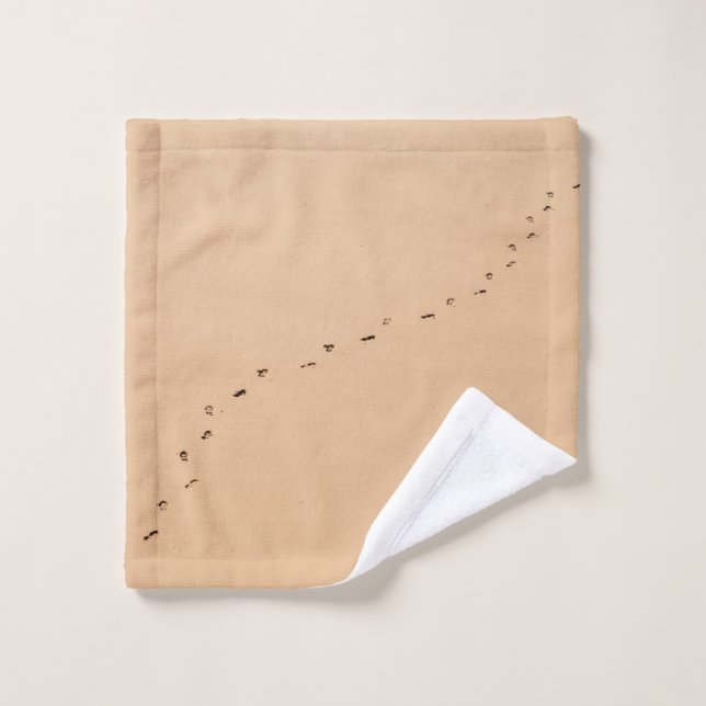 Photographie aérienne des empreintes dans le sable (Gant de toilette)