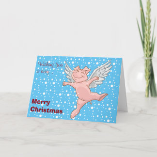 Pig volant dans la carte de Noël de neige