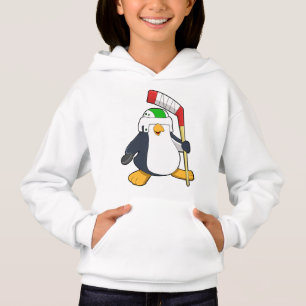 Pingouin au hockey sur glace avec bâton de hockey 