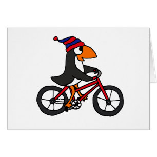 Pingouin drôle montant la bicyclette rouge