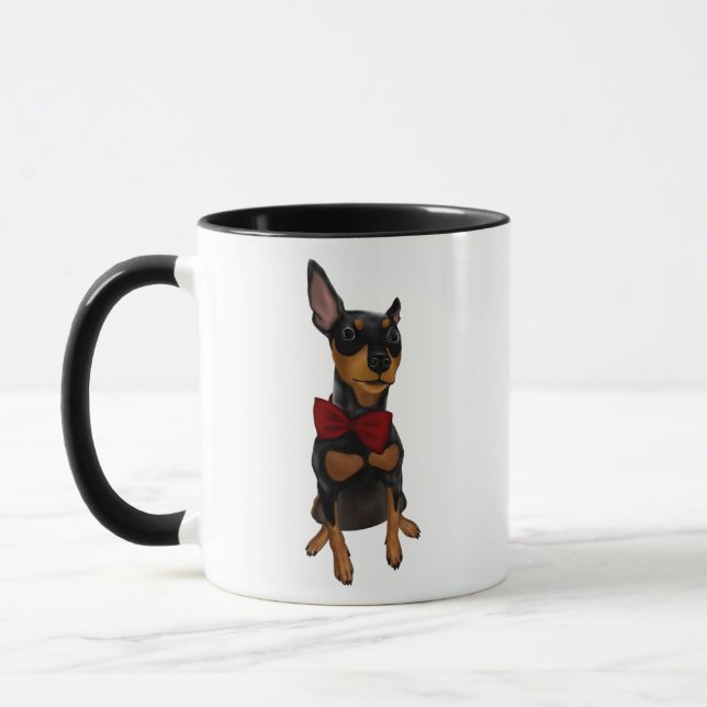 Pinscher miniature (Pin de minute) avec la tasse (Gauche)