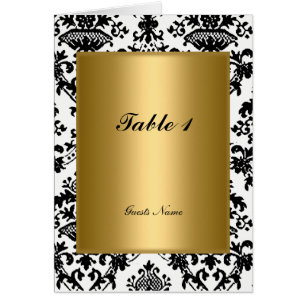 Placement de table en or et damas et carte de menu