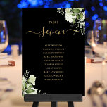 Plan Floral Noir Et Or Numéro De Table<br><div class="desc">Ces élégants numéros de table feuille en mariage de verdure noir et or peuvent être personnalisés avec le plan de séjour de vos invités dans la typographie chic. Les cartes sont imprimées à l'avant et à l'arrière (recto double). Conçu par Thisisnotme©</div>