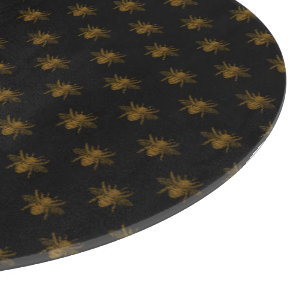 Planche À Découper Abeilles en feuille métallique dorée sur fond noir