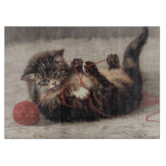 Planche À Découper Berceau de chat, un chat jouant avec une pelote de (Devant)