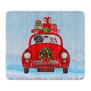 Planche À Découper Chien teckel dans une voiture avec le Père Noël