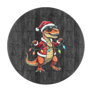 Planche À Découper Dinosaure enveloppé de lumières de Noël Santa Hat