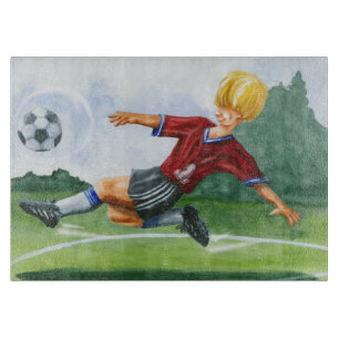 Planche À Découper Footballeur donnant un coup de pied une boule par