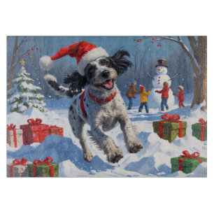 Planche À Découper Griffon à poil dur avec un chapeau de Noël enneigé