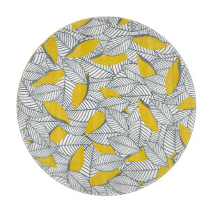 Planche À Découper Motif de feuilles gris et jaune.