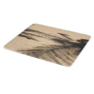 Planche À Découper Ombres sur le sable