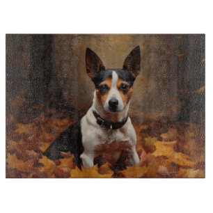 Planche À Découper Rat Terrier dans les feuilles d'automne qui tomben