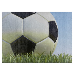 Planche À Découper Soccer ball sur grass.