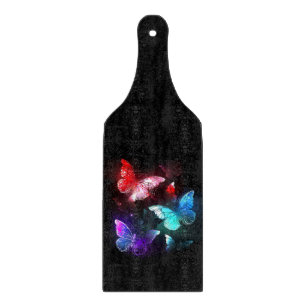 Planche À Découper Trois papillons brillants sur l'arrière - plan de