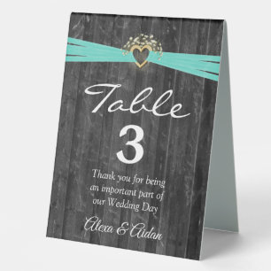 Plaque De Table Coeur d'or avec ruban turquoise sur bois gris