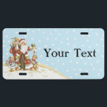 Plaque D'immatriculation Jote Père Noël Folk Art Kids Christmas Snowflakes<br><div class="desc">C'est une image vintage d'une adorable et mignonne clause d'art populaire du Père Noël entourée d'enfants et de bébés sucrés. Il tient une lanterne et le groupe marche dans la neige de Noël. Voir mon magasin Art by MAR pour apparier les produits avec ce design.</div>