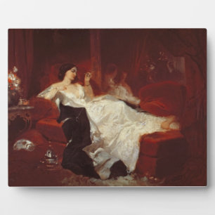 Plaque Photo Femme sur un canapé rouge