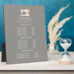 Plaque Photo Machine à coudre Or Seamstress Prix gris<br><div class="desc">La conception sous-estimée affiche vos services, votre liste de prix ou des informations commerciales sous une illustration d'une machine à coudre vintage en faux or sur un arrière - plan gris taupe et votre nom ou nom d'entreprise. Comprend trois en-têtes personnalisables et des champs de texte corps. Pour ajuster la...</div>