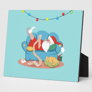 Plaque Photo Père Noël sur le canapé en pyjama