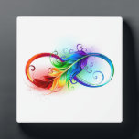 Plaque Photo Symbole d'infini avec plume arc-en-ciel<br><div class="desc">Symbole artistique à l'infini avec belle plume arc-en-ciel sur arrière - plan blanc. Style tatouage.</div>