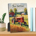 Plaque Photo Tracteur rouge vintage en champ Image agricole rus<br><div class="desc">Cette plaque nostalgique est ornée d'une photo rétro d'un tracteur rouge sur un champ. Idéal pour les amateurs de tracteurs vintages,  l'image présente une campagne calme pleine de charme rustique. Personnalisez-vous pour une occasion spéciale avec vos propres mots en typographie de script élégante au sommet.</div>