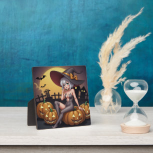 Plaque Photo Une sorcière d'Halloween aux yeux verts sur Jack-O