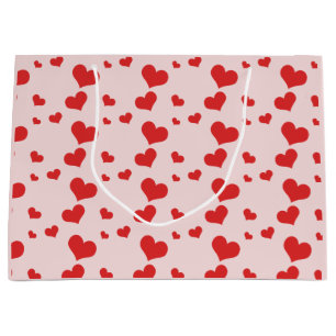 Plusieurs coeurs rouges sur un mignon sac cadeau