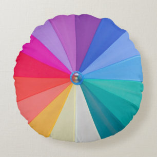 Poinçons colorés sur coussin rond en coton