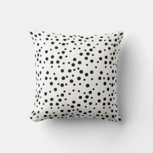 Pois noirs de différentes tailles sur Coussins per