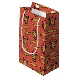 Poisson égyptien, crocodile sur sac cadeau rouge
