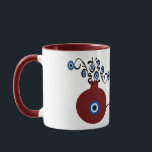 pomegranate with evil eye mug<br><div class="desc">Pomegranate in many cultures symbolizes abundance,  blessing,  fertility,  and immortality. And the evil eye to ward of the negativity when you begin your day with a coffee in this unique mug.</div>