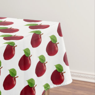 Pommes rouges sur nappe blanche
