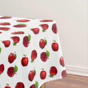 Pommes rouges sur nappe blanche