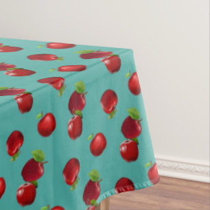 Pommes rouges sur nappe émeraude sarcelle