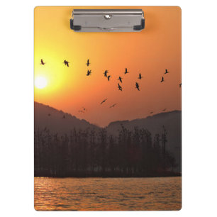 Porte-bloc Oiseaux volant dans le ciel du coucher du soleil s