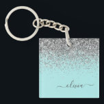 Porte-clefs Aqua bleu Turquoise Parties scintillant argent Mon<br><div class="desc">Aqua Blue - Turquoise et Argent Faux Foil Parties scintillant étincelante Script Monogramme Nom Porte - clé. Cela rend le cadeau parfait pour 16 ans,  mariage,  douche nuptiale,  anniversaire,  baby shower ou bachelorette pour quelqu'un qui aime le luxe glam et les styles chic.</div>