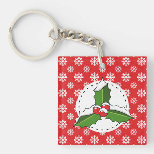 Porte-clefs Baie de houx sur motif flocons de neige rouges et