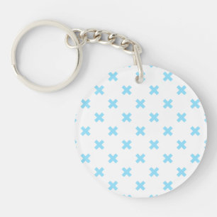 Porte-clefs Bébé bleu croix coutures sur blanc