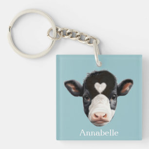 Porte-clefs Belle vache noire et blanche face sur bleu ciel