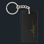 Porte-clefs Black Gold Modern Script Girl Monogramme Nom<br><div class="desc">Noir et or Simple Script Monogramme Nom Porte - clé. Cela rend le cadeau parfait pour 16 ans,  mariage,  douche nuptiale,  anniversaire,  baby shower ou bachelorette pour quelqu'un qui aime le luxe glam et les styles chic.</div>