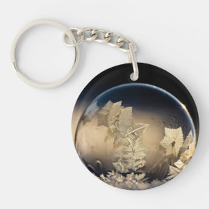 Porte-clefs Boule à feuilles d'or remplie en neige