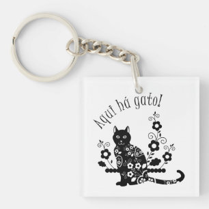 Porte-clefs Chat noir avec fleurs et expression portugaise